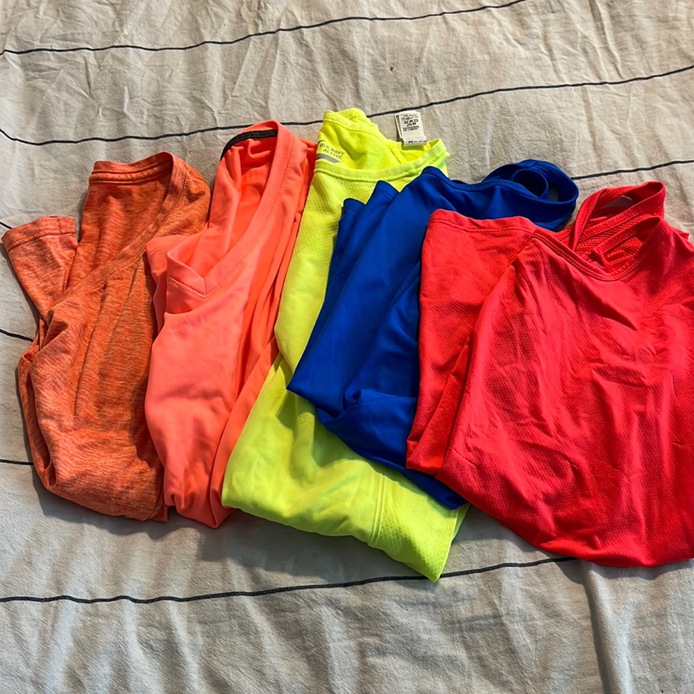 Bundle of athletic tops, different brands